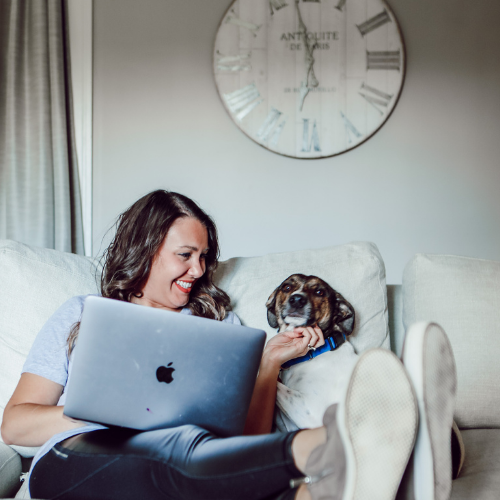 Allison with laptop and dog